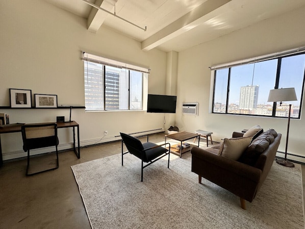 Spacious living room with city skyline views