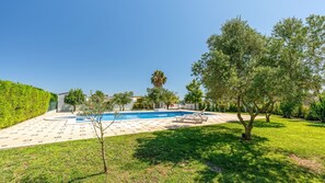 Lounge by the sparkling pool surrounded by lush greenery and Mediterranean vibes. #OutdoorOasis #PoolDays