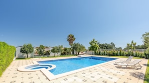 Refresh with a dip in the stunning pool or soak up the sun in this lush outdoor oasis. #PoolsidePerfection #SummerVibes
