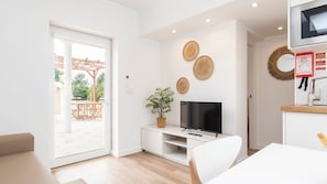 This stylish living area combines natural textures and sleek design, with direct access to the terrace. #CozyChic #RelaxAndUnwind