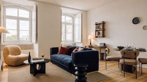 Bright living room with cozy seating, natural light, elegant decor, wooden floors, and warm, inviting ambiance.
#LivingRoom
#CozyHome
#InteriorDesign
#NaturalLight
#AndoLiving