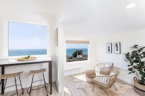 Livingroom ocean and sunset views