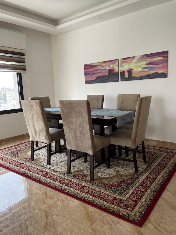 dining table for 6 adjacent to salon and balcony