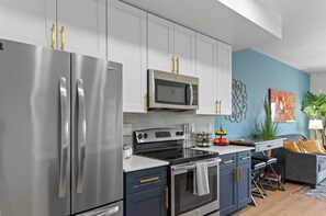 A modern, well-equipped kitchen that blends practicality with contemporary style.