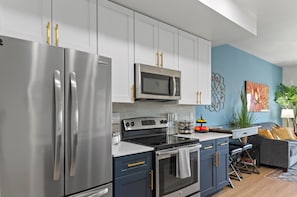 A modern, well-equipped kitchen that blends practicality with contemporary style.