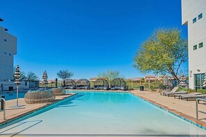 A refreshing shared oasis ideal for swimming, sunbathing, and socializing under the open sky.