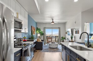 A modern, well-equipped kitchen that blends practicality with contemporary style.