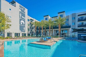 A refreshing shared oasis ideal for swimming, sunbathing, and socializing under the open sky.