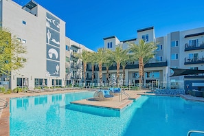 A refreshing shared oasis ideal for swimming, sunbathing, and socializing under the open sky.