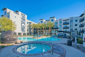 A refreshing shared oasis ideal for swimming, sunbathing, and socializing under the open sky.