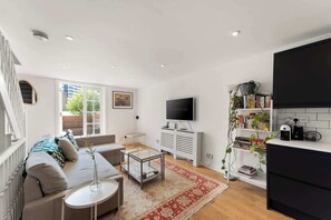 The features  arranged around a central area, creating a warm and comfortable space for relaxing or socializing. The setup adds to the room's welcoming atmosphere.