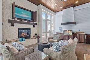 Grill burgers and watch the game in this great indoor/outdoor area