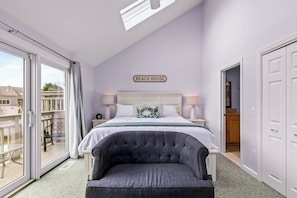 A comfy King bed invites you to relax, while stylish lounge chairs