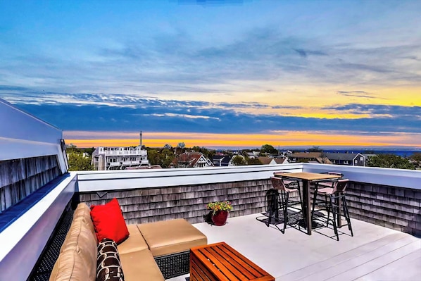 Sink into the cozy outdoor sectional and toast to unforgettable sunsets.