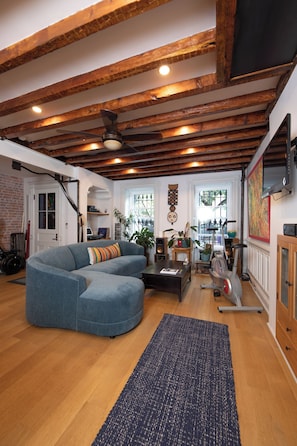 Living Room with Remote Work Space, Exercise Equipment & New Samsung 4K Monitor