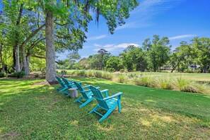 Outdoor Leisure: Stylishly landscaped, complete with a propane grill and outdoor seating