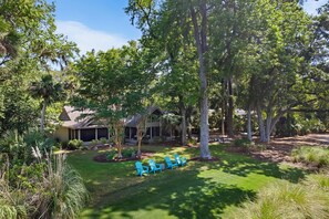 Golf Course Views: Relax in Adirondack chairs while enjoying views of the lush green