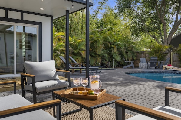 Relax and unwind in the fully covered lanai with Smart TV and fans to keep you cool