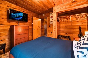 Unwind in the peaceful master bedroom with a full-size bed and a 43" smart TV for late-night movies or morning news.