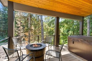 Cozy up around the firepit by the deck, the perfect spot to unwind and enjoy the outdoors.