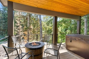 Cozy up around the firepit by the deck, the perfect spot to unwind and enjoy the outdoors.