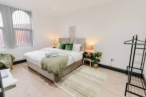Bedroom 1 : Super king size bed (Twin Single beds that can be separated), Bed linen, clothes rail, mirror, Hangers, Table and Chair