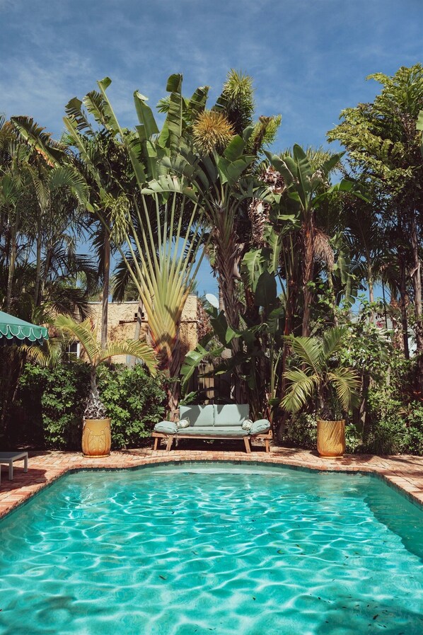 Our idyllic, sun-splashed pool (shared) is right out of a summer dream.
