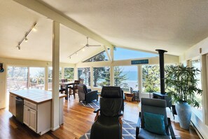Open concept with walls of windows.