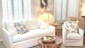 Inviting Living Area: Unwind on comfortable seating in the cozy living room, ideal for family gatherings.