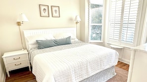 Spacious Primary Suite: Relax in the king-sized bed with private ensuite bathroom, offering comfort and privacy.