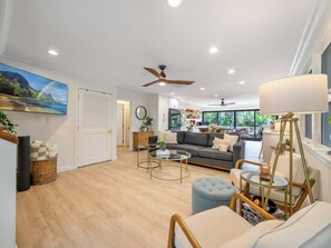 Great room with new luxury vinyl, tons of natural light & huge new kitchen.