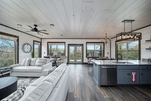 A living room that is so inviting, serene, and perfectly framed by the stunning landscape of Mount Le Conte.