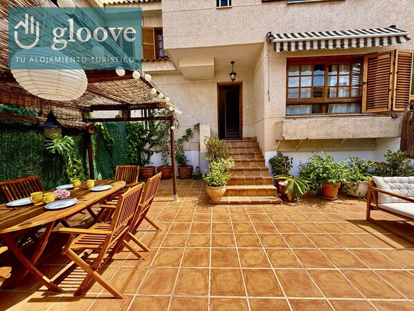 Large spacious terrace equipped with table and chairs, perfect for enjoying meals in the sun and outdoor dining on summer evenings.  It also has comfortable furniture to relax while enjoying the fresh air and pleasant surroundings.