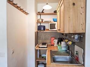 Kitchen, Wood, Interior Design, Kitchen Appliance, Furniture, Major Appliance, Countertop, Cabinetry, Shelf, Room