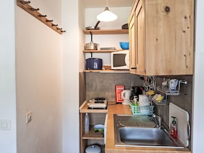 Kitchen, Wood, Interior Design, Kitchen Appliance, Furniture, Major Appliance, Countertop, Cabinetry, Shelf, Room