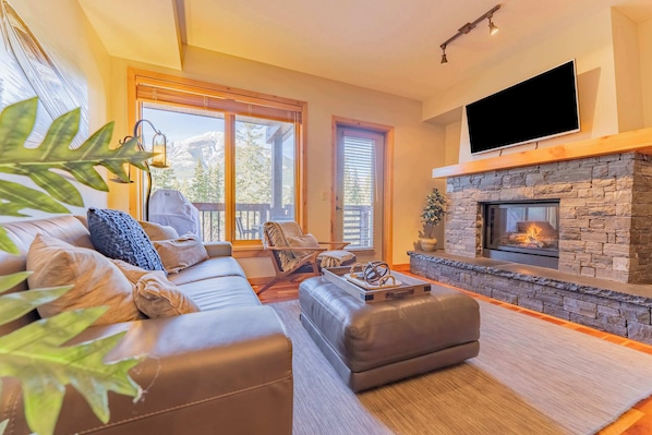 Cozy living space complete with mountain views and gas fireplace