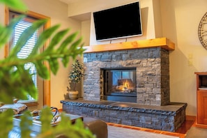 Curl up in front of the cozy gas fireplace after a long day in the mountains