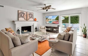Curl up in the chic living room & enjoy a fireside movie night