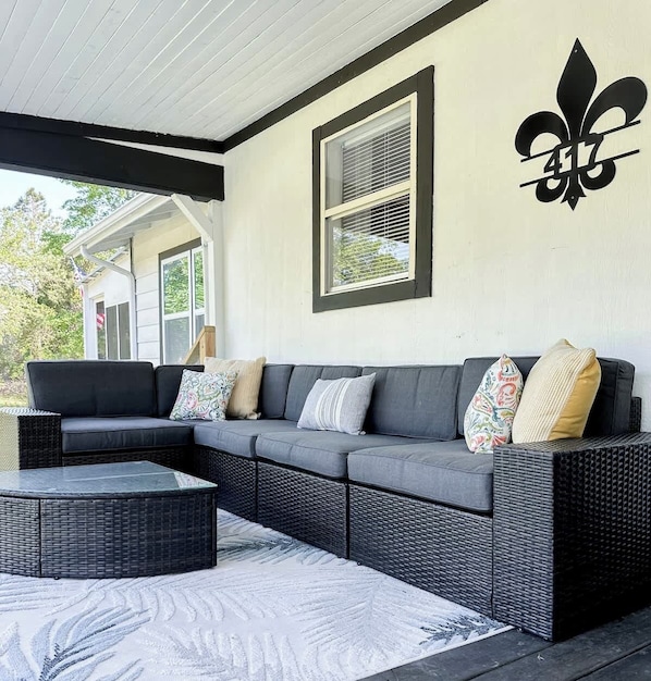 "Chill vibes, cozy corners, and a touch of southern charm! 🖤 #PorchGoals"