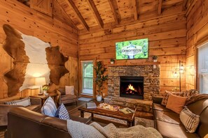 Gather around the cozy gas fireplace in the heart of the home—this warm, inviting living room is perfect for movie nights, board games, or simply curling up with a book.