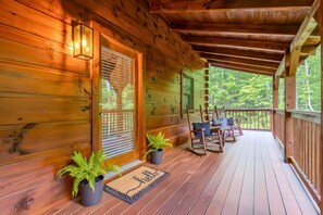 Start your mornings or end your evenings on the covered front porch, where classic rocking chairs and serene forest views invite you to slow down and savor the moment.