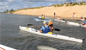 Paddle through calm, scenic waters near the dunes