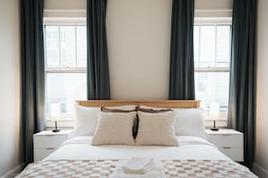 Secondary bedroom with queen size bed and premium pillows and linens.