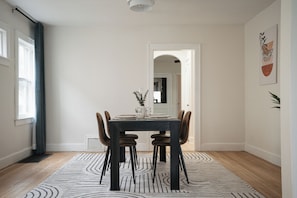 Large dinning room with a table that sits 4 people.