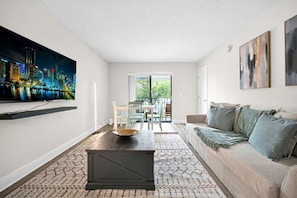 Comfort meets design—modern living room with balcony views in Boca Raton