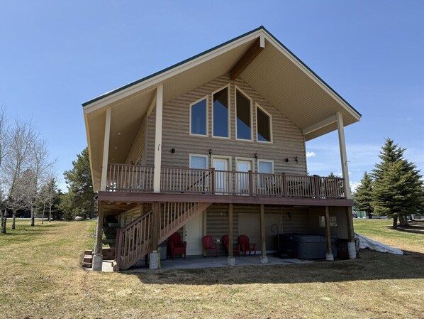 Enjoy incredible mountain and golf course views from the back deck at Thundering Herd Lodge
