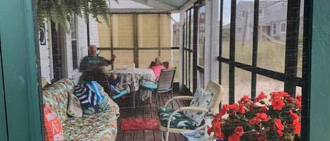 Screened view of the front porch.