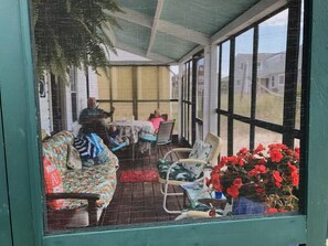 Screened view of the front porch.