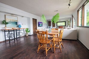 Gather around the dining table — whether for meals, work, or games, there’s room for everyone.