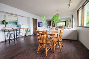 Gather around the dining table — whether for meals, work, or games, there’s room for everyone.